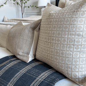 A close up of Ester Lumbar and Georgia throw pillows