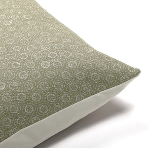 Upper corner of the Matilda Olive Lumbar Pillow Cover from Colin and Finn showing the floral front in olive and white and the ivory backing.