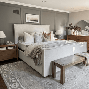 Bedroom view with the Stevie pillow combination on a white bed.