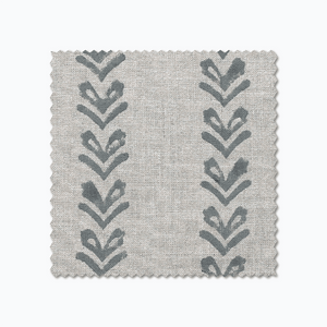 Blaine fabric swatch from Colin and Finn. Blue arrows on a gray fabric