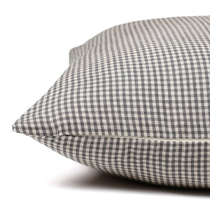 Side view of the Caldwell gingham pillow cover showing the invisible zipper between the blue patterned front and back.