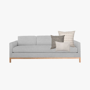 Soft gray sofa with Greyson pillow combination.