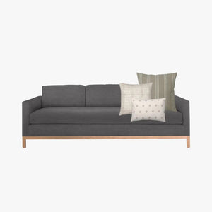 Dark gray sofa with Colin and Finn's Hawthorn pillow combo.