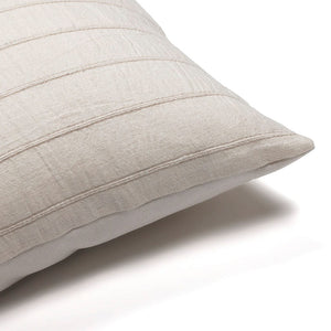 Upper corner of Logan lumbar pillow cover from Colin and Finn on a white backdrop.