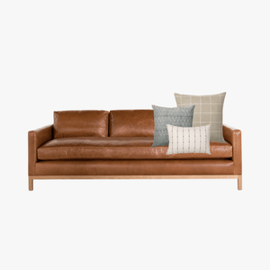 Cognac leather sofa with Naples mock-up on it with a white background.