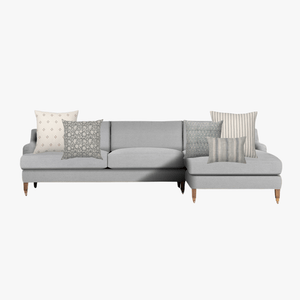 Light gray sectional couch mockup with Colin and Finn's Pacific combination.
