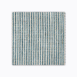 Quinn fabric swatch from Colin and Finn. A turquoise woven stripe on natural fabric