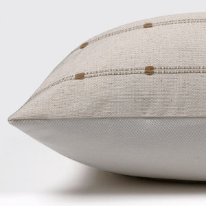 Side view of Rory pillow from Colin and Finn showing ivory and rust front and solid ivory backing.