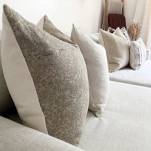 Closeup view of Fitz pillow cover with Walter pillow combination on a sofa.