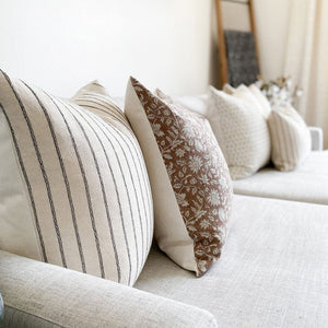 Close-up view of Winston and Eleanor natural pillow covers from Colin and Finn.