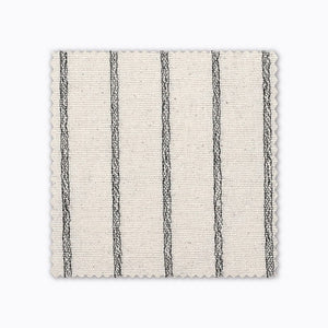 Winston fabric swatch from Colin and Finn. An ivory/cream Thai cotton with black woven stripes