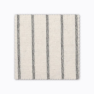 Winston fabric swatch from Colin and Finn. An ivory/cream Thai cotton with black woven stripes