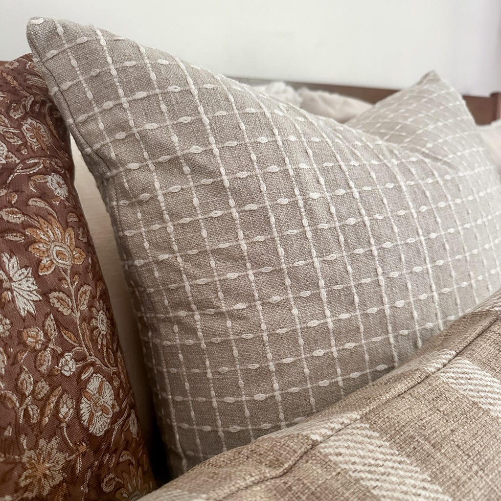 Closeup detail of the Esme pillow cover, showing the intricate detailing of the slub patterning.