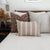 Esme, Agnes, and Caspian lumbar pillow covers from Colin and Finn on a neatly made bed with a cream quilt and wood headboard. Fall home decor sits on the side table.