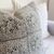 Closeup view of Anderson pillow cover with blurred out Winston pillow cover in the background.