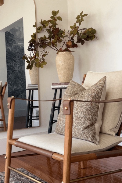 Elain pillow cover from Colin and Finn on a cream side chair.