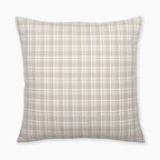 Colin and Finn's Copeland Pillow Cover showcased in a flat lay on a white background, featuring a subtle small plaid design in cream and taupe hues.
