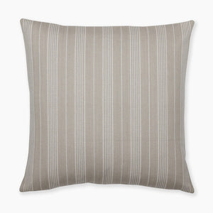 Flat lay of the Dayson pillow cover featuring grayish olive and cream vertical stripes on a white background from Colin and Finn.