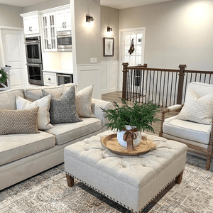 Delilah, Lydia, Arizona, Luella, and EmeryLumbar sitting on a beige couch in a living room