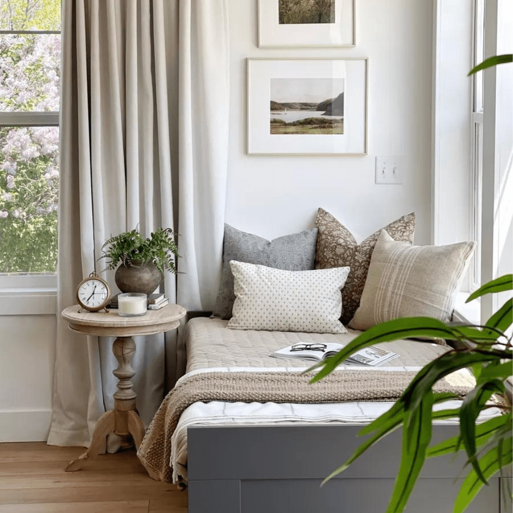 A daybed in the corner of a room with Eloise, Eleanor Natural, Kinsey, and Elodie Lumbar pillows