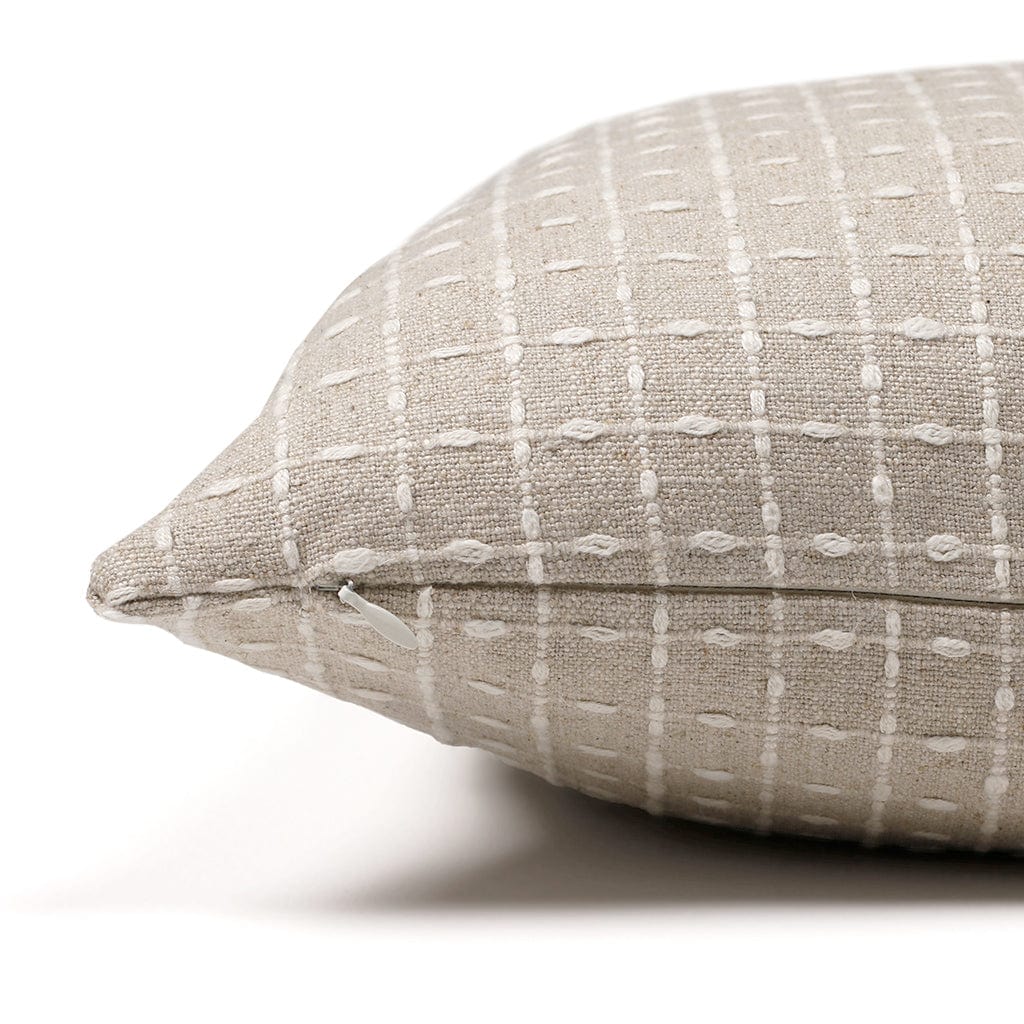 Upper corner of the Esme pillow cover from Colin and Finn showing the ivory slub patterning on the front and back. Invisible zipper shown.