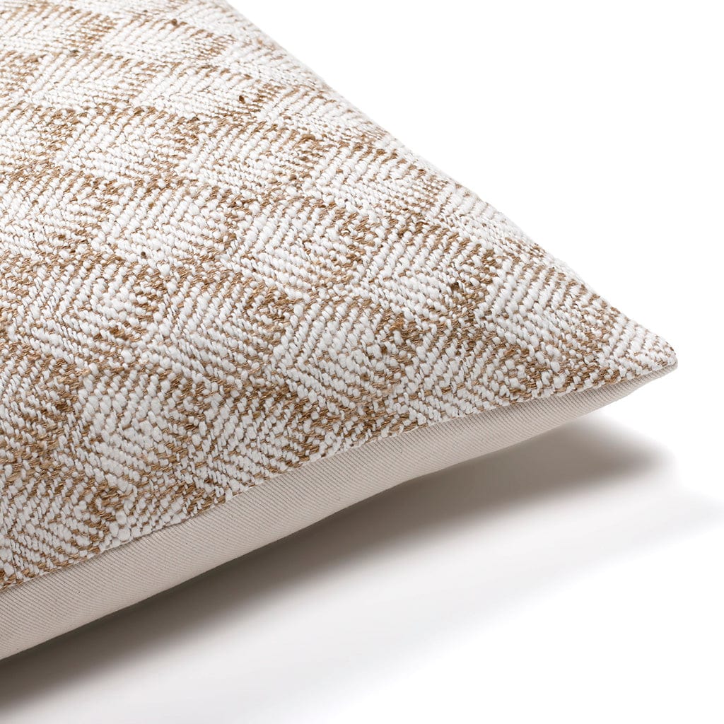 Upper corner of Jade lumbar pillow cover showing the flax and white pattern on the front.