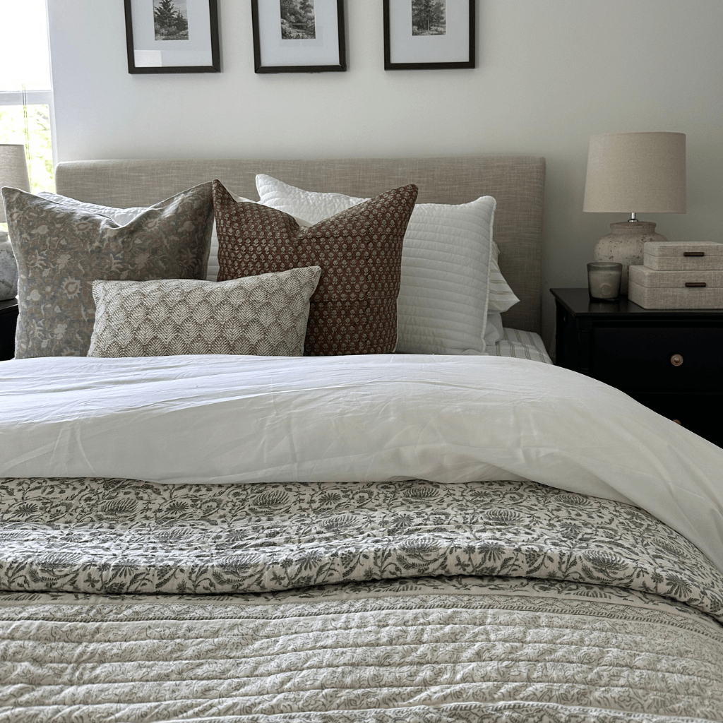 A bed with a gray headboard and Kennedy, Emery, and Jade Lumbar