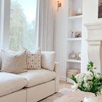 Leighton and Louise on a cream couch