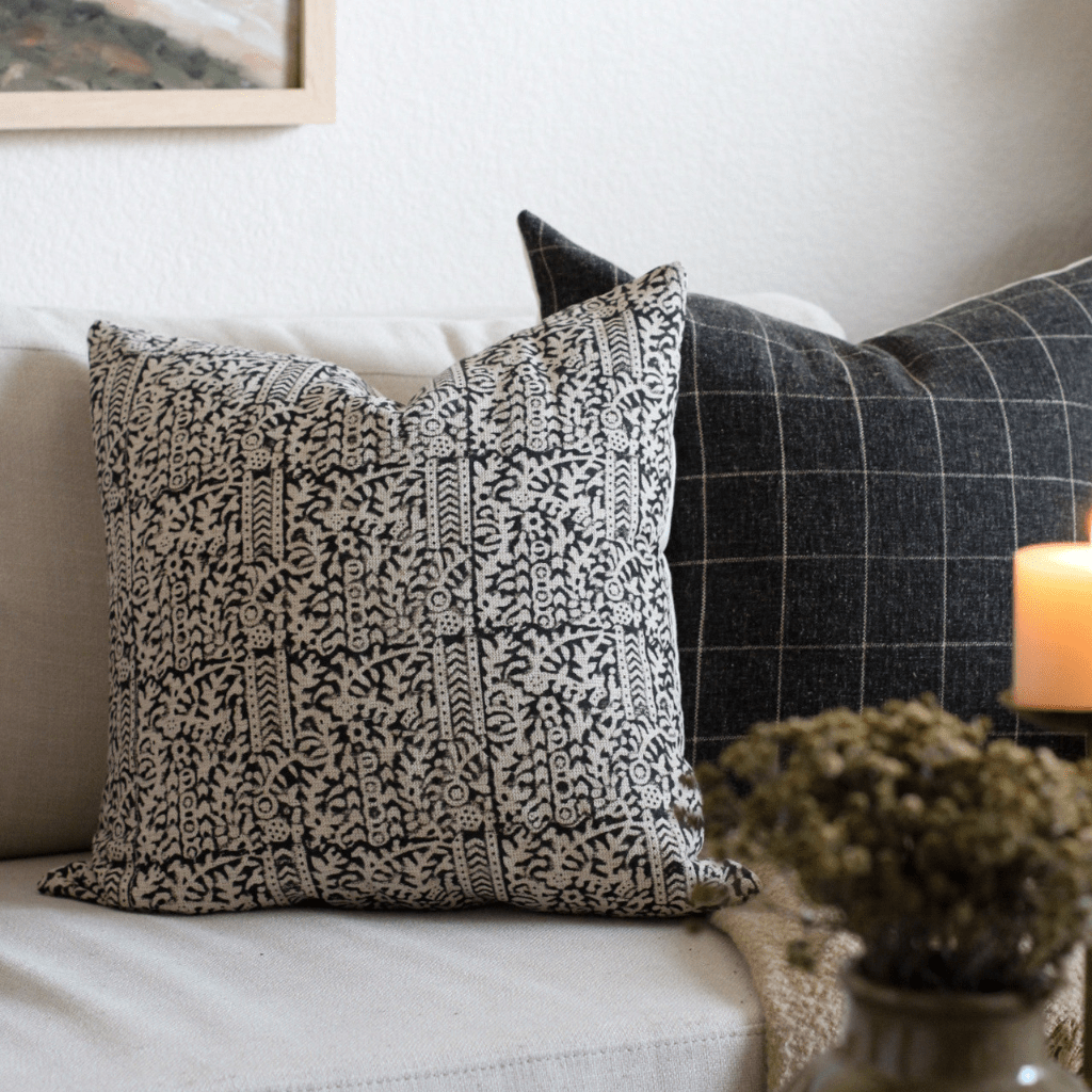 A close up of two pillows, Madison and Mavis,  on a couch