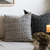 A close up of two pillows, Madison and Mavis,  on a couch