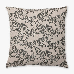 Magnolia pillow cover from Colin and Finn showing a taupe textile with charcoal bird and floral motif.