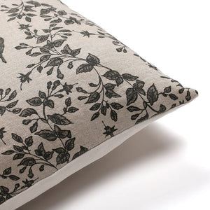 Upper corner of Magnolia pillow cover from Colin and Finn showing taupe and charcoal floral front and ivory back.