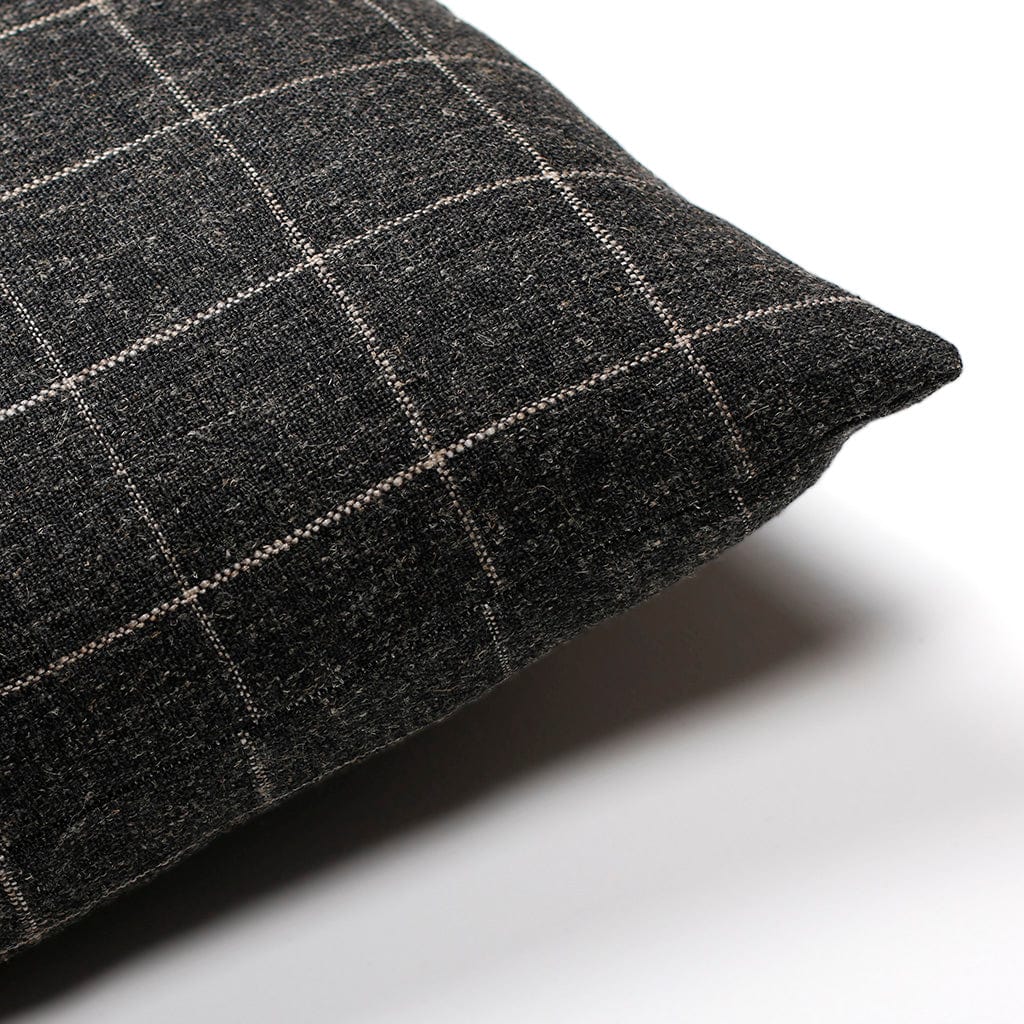 Upper corner of Mavis pillow cover from Colin and Finn showing same fabric on the front and back. Pillow is on a white background.