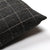 Upper corner of Mavis pillow cover from Colin and Finn showing same fabric on the front and back. Pillow is on a white background.