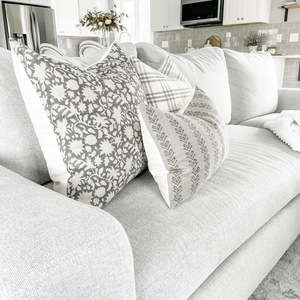 A close up of three pillows on a gray couch, Sawyer, Bailey, and Blaine Lumbar