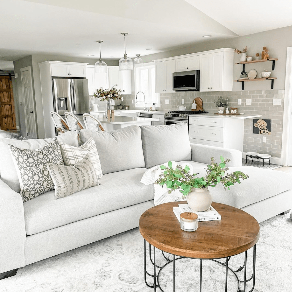 A living room with a gray sofa in the center with three pillows, Sawyer, Bailey, and Blaine Lumbar