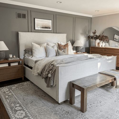 Bedroom view with the Stevie pillow combination on a white bed.