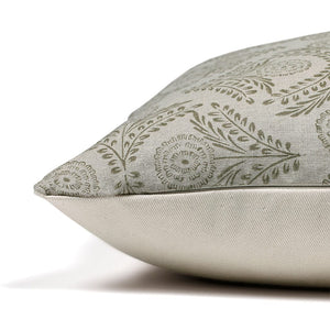Side view of Avery pillow cover showing invisible zipper, natural gray linen and green floral block print front, and ivory backing. 