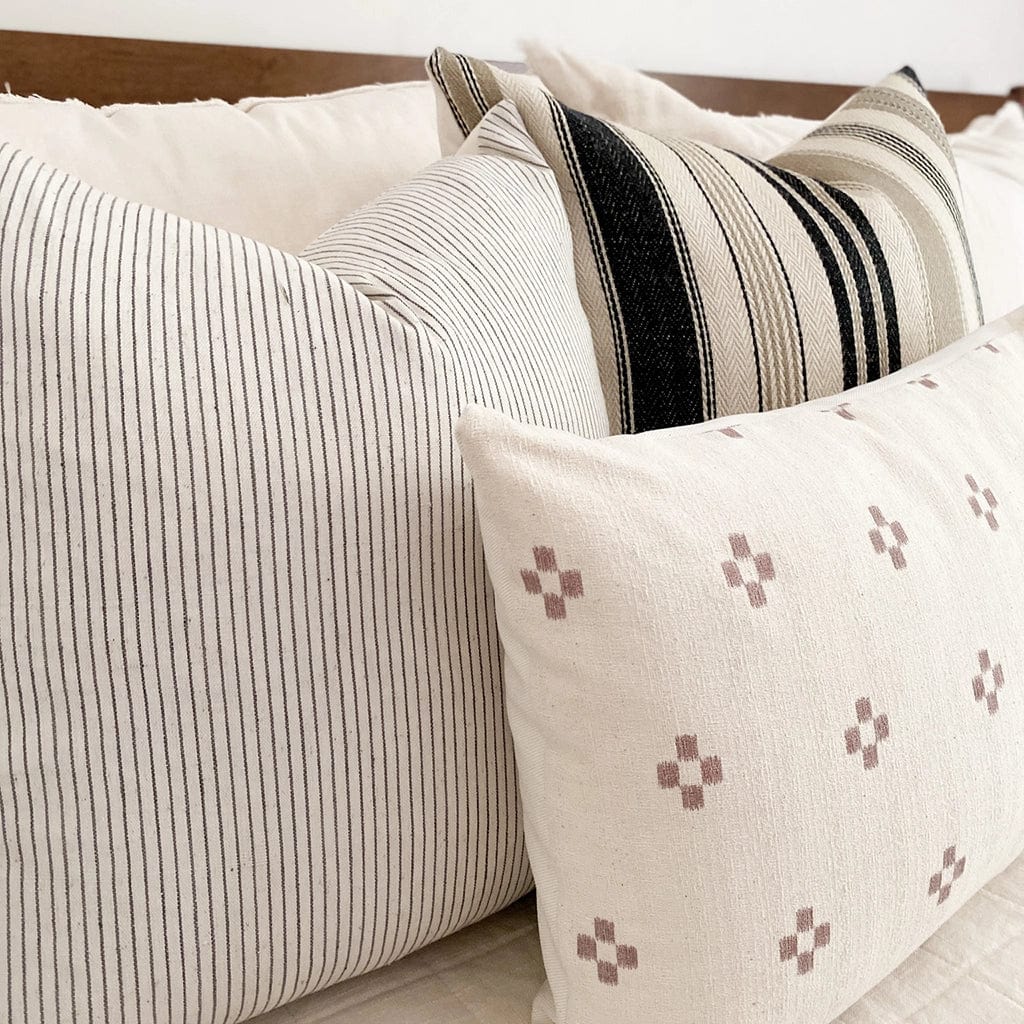 Side view of Benedict, Laney, and Dara lumbar showing front textiles and ivory backing.