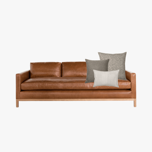 Faux leather couch mockup with Bernard pillow combination from Colin and Finn with Fitz, Waylon, and Laney lumbar.