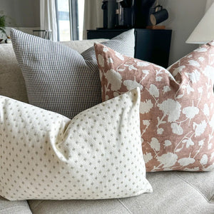 Caldwell, Jasmine, Elodie lumbar pillow covers from Colin and Finn on a gray sofa.