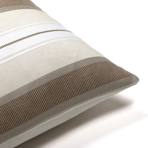 Corner of the Charles pillow cover showing the stripe detailing and the ivory backing.