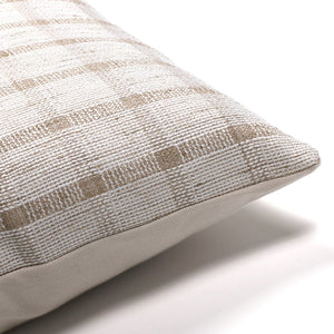 Corner of Darby pillow cover from Colin and Finn showing white and taupe checker front with solid ivory back.