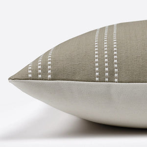 Side of the Darcy pillow showing the olive grey with ivory stripe front and the ivory backing