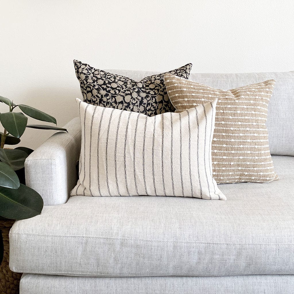 Edina, Bardot, and Winston lumbar pillow covers on white sofa.