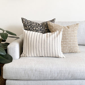 Edina, Bardot burlap, and Winston lumbar pillow covers from Colin and Finn on cream sofa with plant on left of sofa.