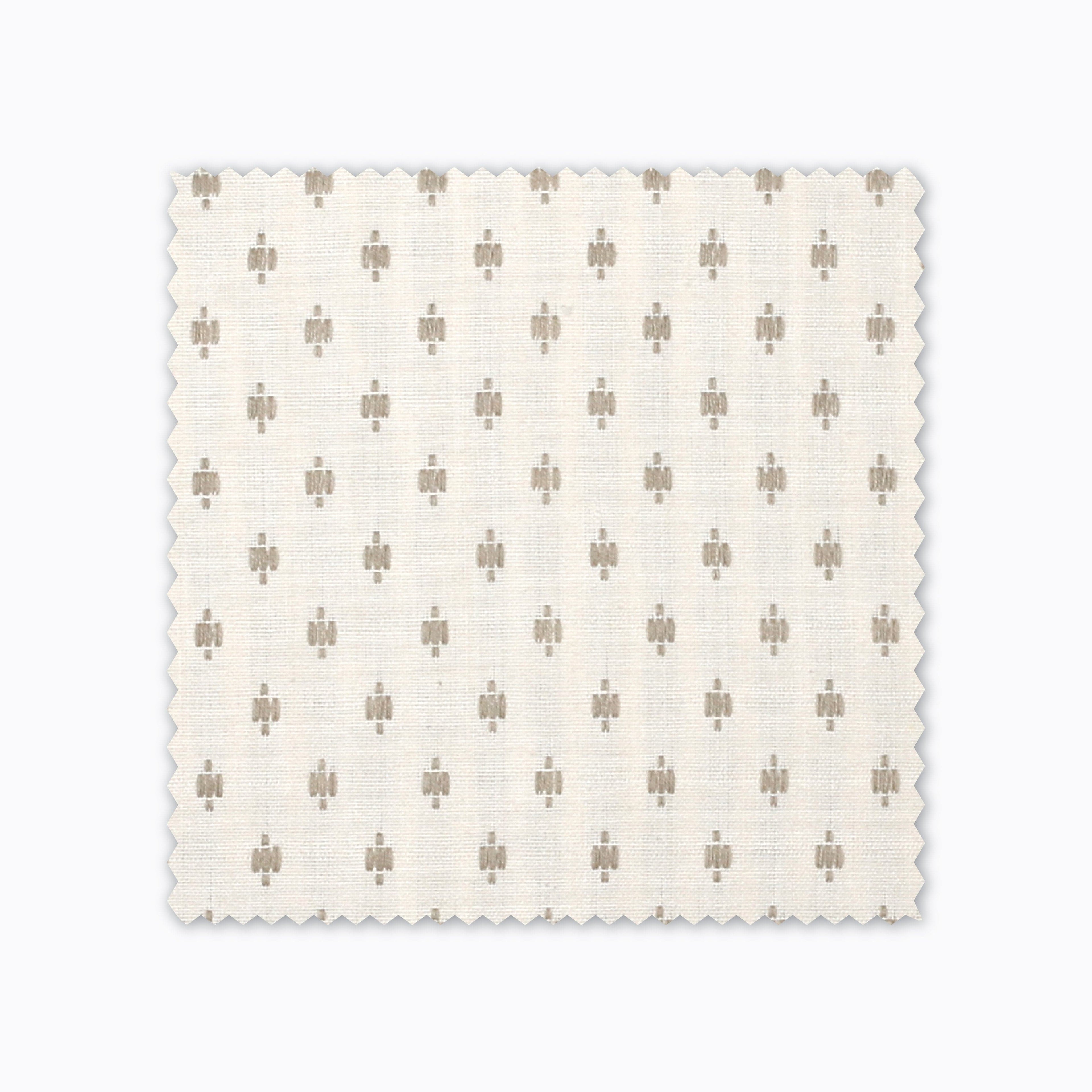 Elodie fabric swatch from Colin and Finn. Small gold crosses on a cream background