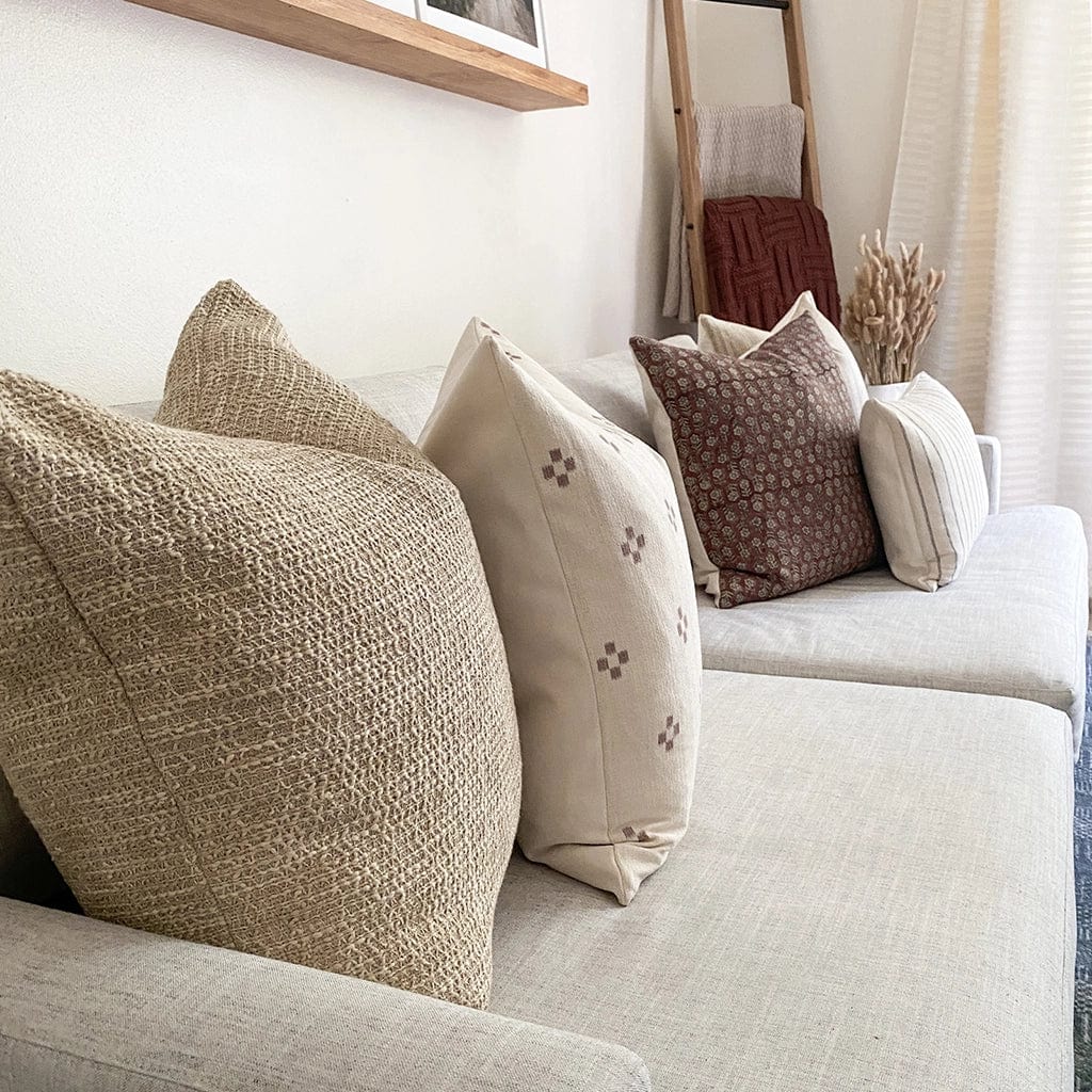 Weston, Dara, and Serena pillow covers on white sofa from the Georgina pillow combination.
