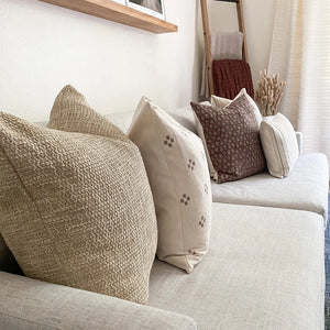 Weston, Dara, and Serena pillow covers on white sofa from the Georgina pillow combination.