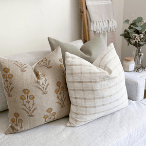 Griffin, Remington, and Darby pillow covers on cream sofa.